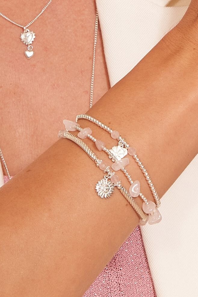 The Edith Crystal is a unique necklace design with a subtle hint of sparkle.A unique and charming bracelet stack featuring three lovely bracelets with floral charms and a pop of colour with Rose Quartz stones.