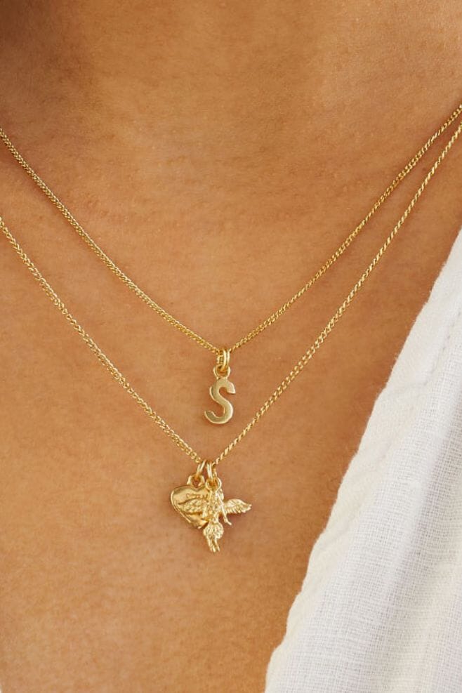 A dainty gold plated Sterling Silver necklace with a choice of cute gold Tiny Initial charms.
