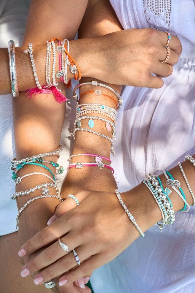Ring stack featuring two new designs in 925 Sterling Silver and orange, pink, white and turquoise beads.