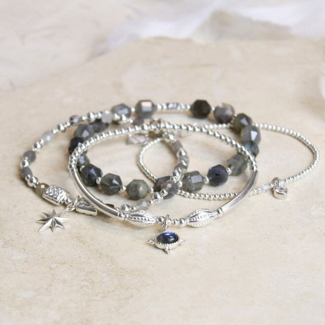 A four-strand bracelet stack, featuring 925 Sterling Silver and Labradorite.