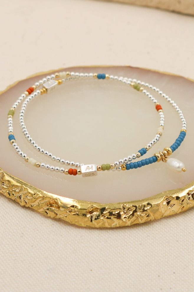 Bracelet stack made with 925 Sterling Silver, gold-plated Silver, Japanese seed beads, featuring a Freshwater pearl charm.