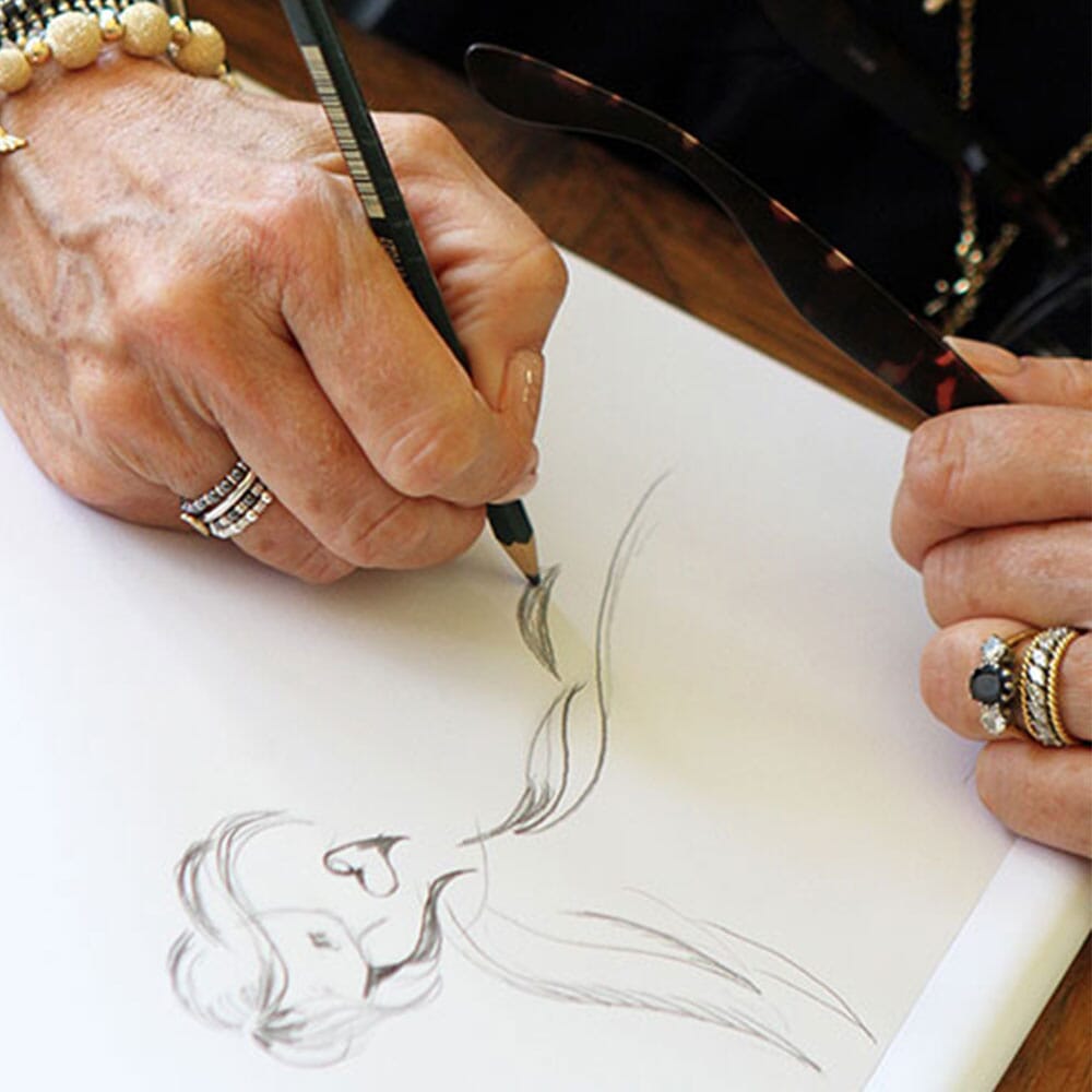 Annie drawing the signature charm