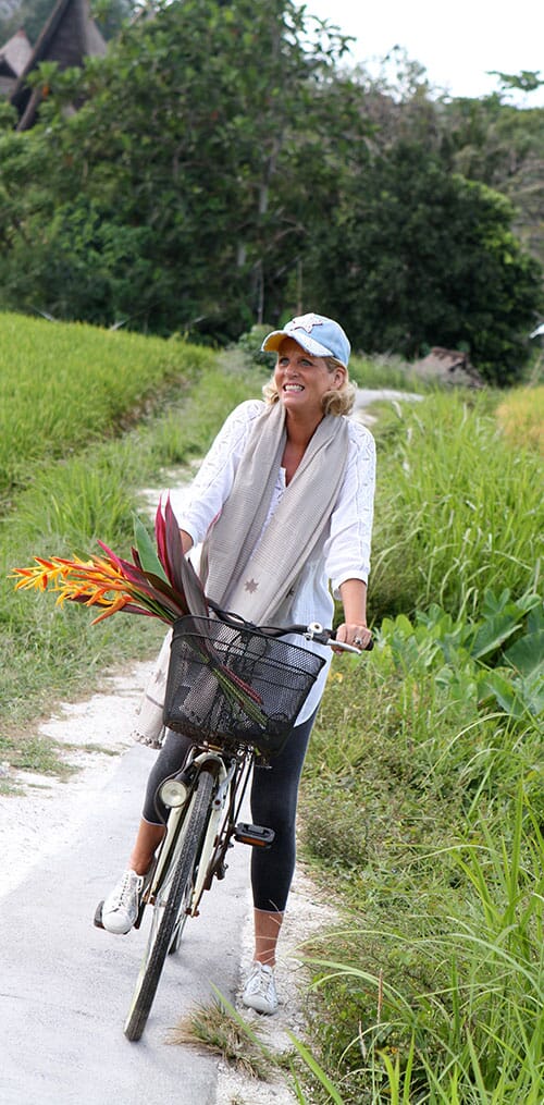 ANNIE HAAK riding a bicycle in Bali