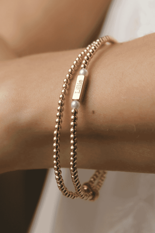 Phoebe Looped Personalised Bracelet. With two elegant loops of gold-plated silver and lustrous Preciosa pearls, this bracelet exudes sophistication.