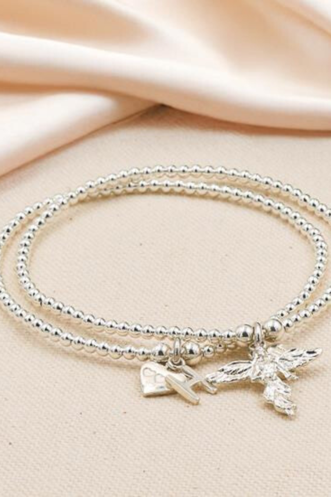 Santeenie Duo Silver Bracelet Stack featuring Guardian Angel and initial bracelets.