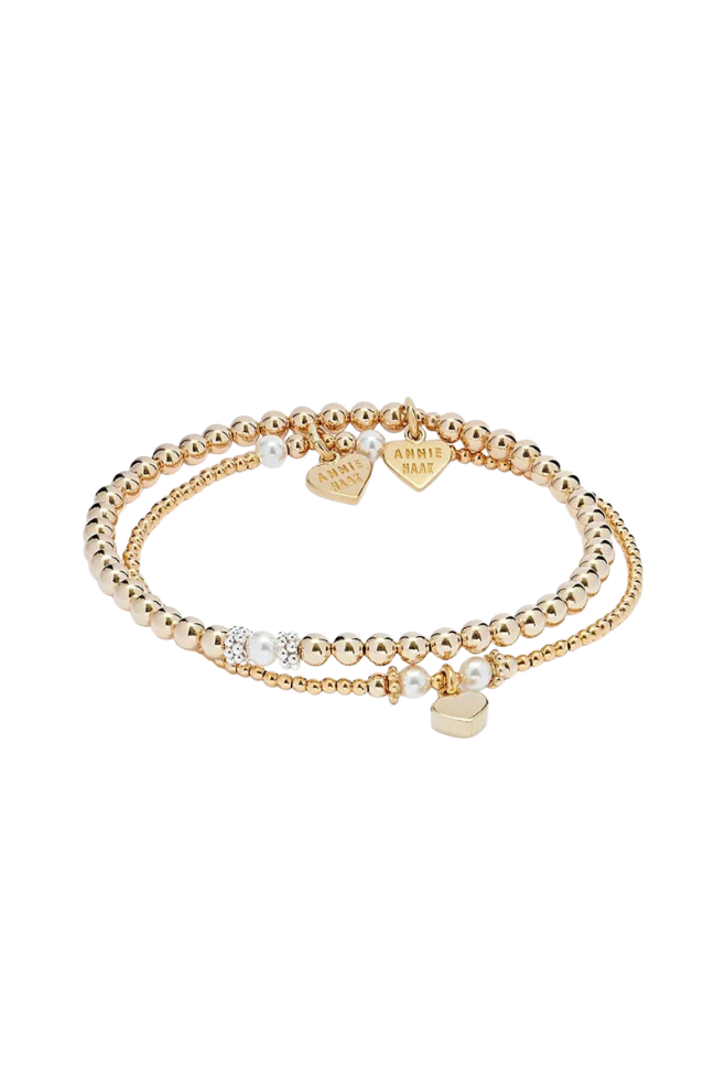 Seri and Ceremony sterling silver bracelet stack with elegant pearl detailing, handcrafted for a timeless layered look.