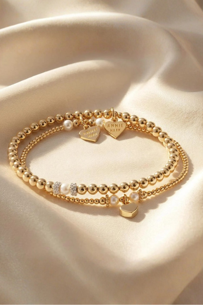 Seri and Ceremony sterling silver bracelet stack with elegant pearl detailing, handcrafted for a timeless layered look.