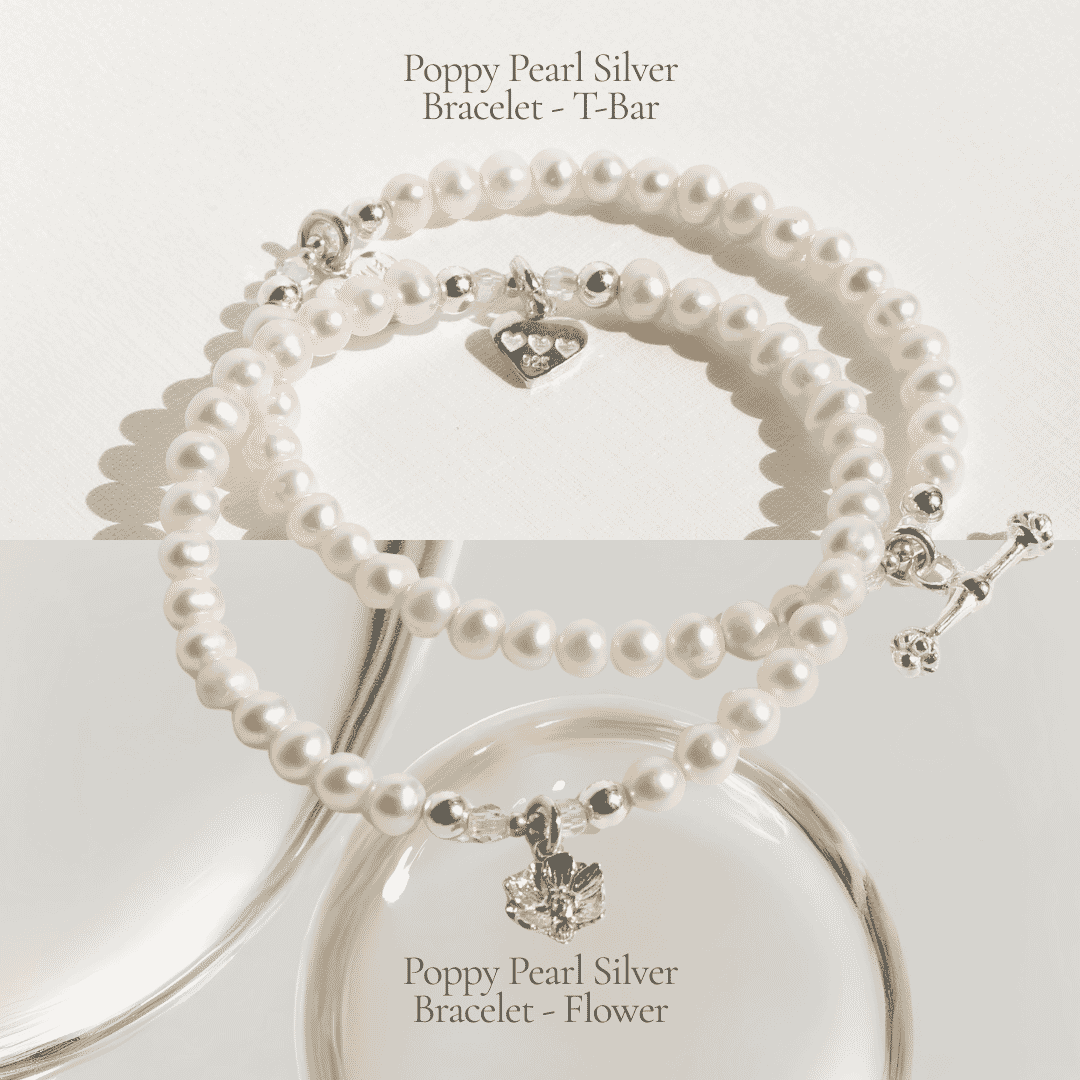 Poppy pearl silver bracelets featuring T-bar and flower charms, styled together for a layered jewellery look.