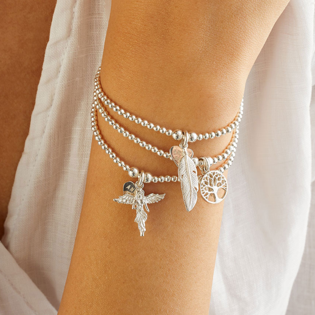 A 925 Sterling Silver bracelet with a feather charm