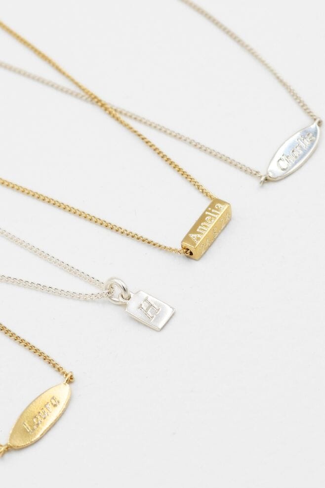 925 Sterling Silver personalised necklace, featuring a unique oblong charm engraved with your message.