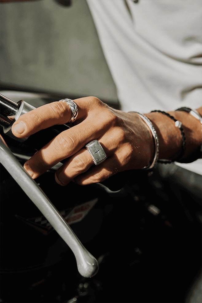This square signet style 925 Sterling Silver ring is engraved with a cross on its front.