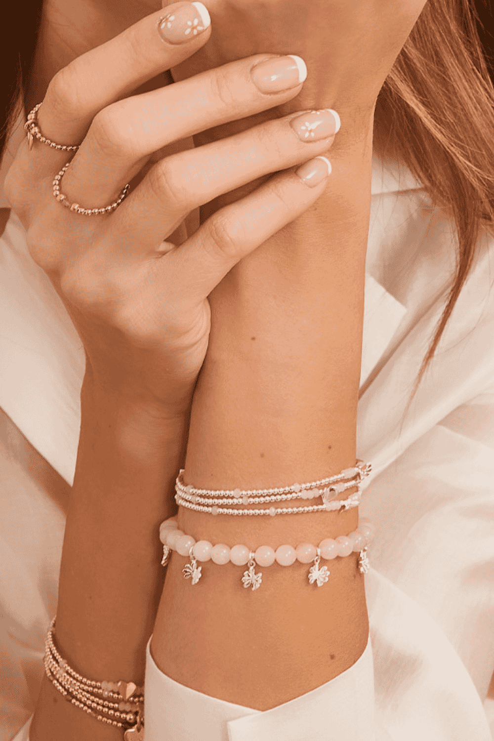 Sweet and playful, the Peony Daisy Silver Bracelet blends rose pink and flowers into one charming design.