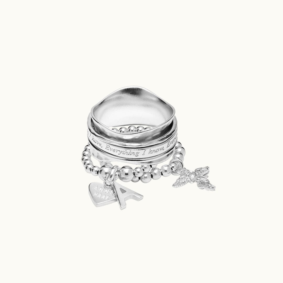 925 Sterling Silver ring stack, including a spinner ring and personalised initial ring stack.