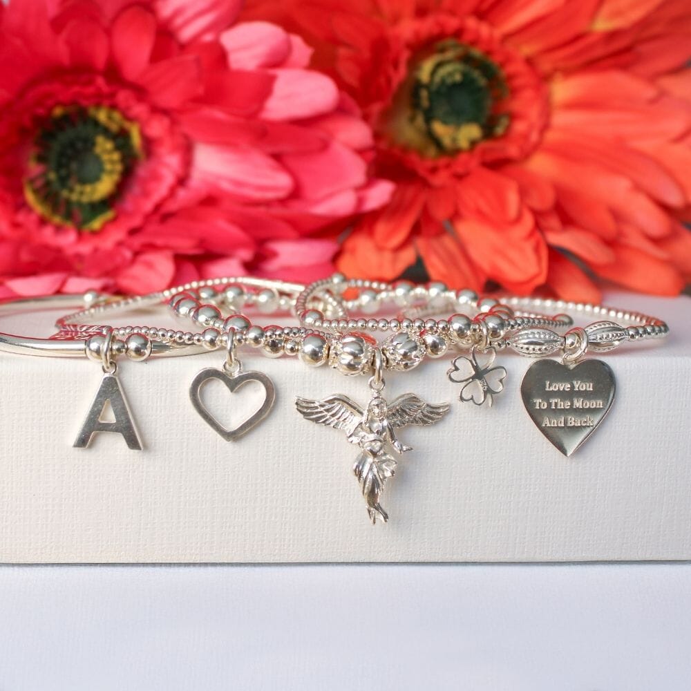 Sama My Guardian Angel Bracelet Stack by Annie Haak in 925 Sterling Silver with five charm bracelets featuring My Guardian Angel, Four-Heart Clover, and Open Heart charms.