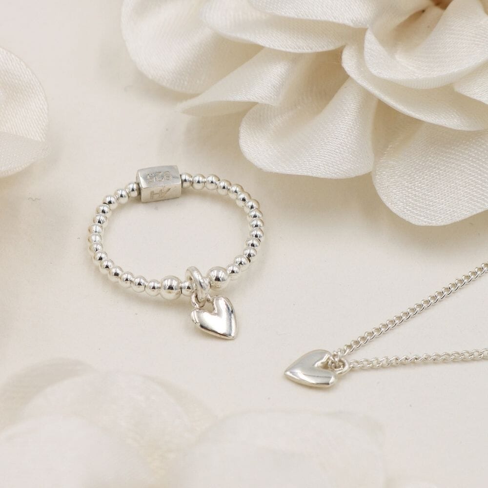 A 925 Sterling Silver ring and necklace with weeny heart charm