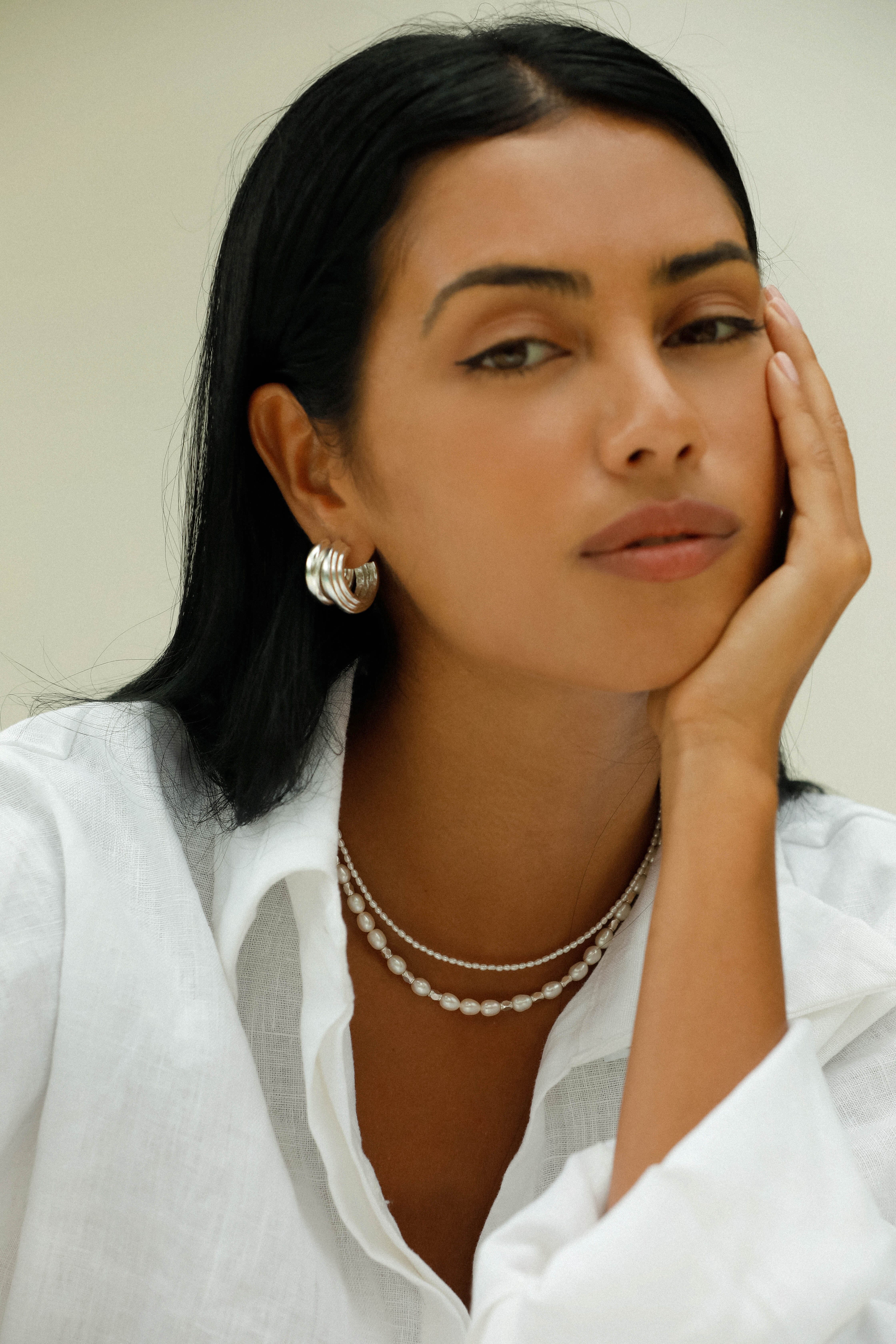 This necklace features luxurious Freshwater Pearls spaced between nuggets of shining Sterling Silver.